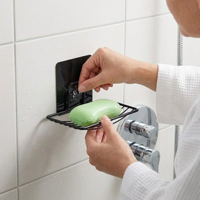 Porte savon mural avec grille de drainage intégrée permettant l'écoulement