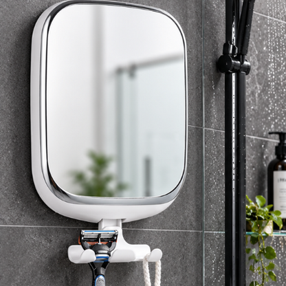 Miroir anti-buée avec porte-rasoir installé sur le mur