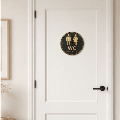 Panneau WC homme femme installé sur une porte