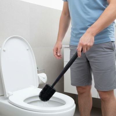 Brosse de toilette muni d'une tête cylindrique à poils denses
