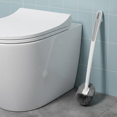 Brosse toilette avec un système de fixation murale