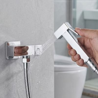 Douchette WC a fixation au mur avec support integre