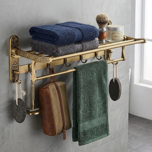 Étagère porte-serviette vintage en laiton avec serviettes pliées