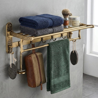 Étagère porte-serviette vintage en laiton avec serviettes pliées