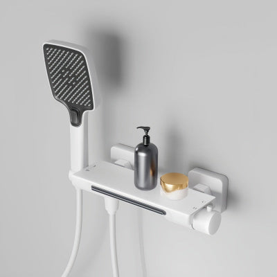 mitigeur baignoire blanc avec pommeau