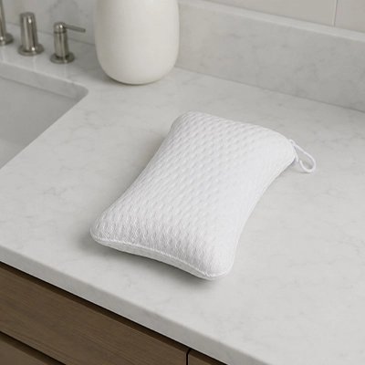 Oreiller de baignoire blanc avec surface douce et confortable