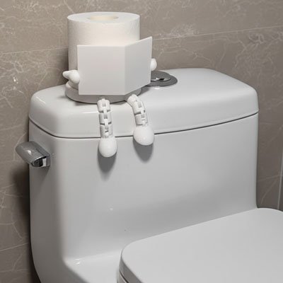 Porte papier toilette en forme de petite figurine assise 