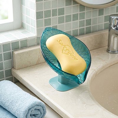 Porte savon a ventouse compact et sureleve optimisant l'espace 