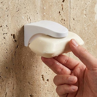 Porte savon aimante permettant l'écoulement de l'eau et séchage 