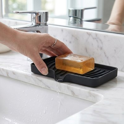 Porte savon en silicone se rinçant rapidement sous l'eau courante