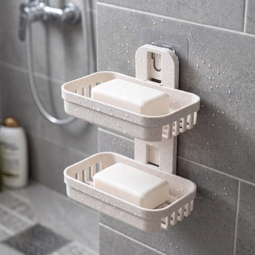 Porte-savon mural beige à deux paniers ajourés fixé au mur