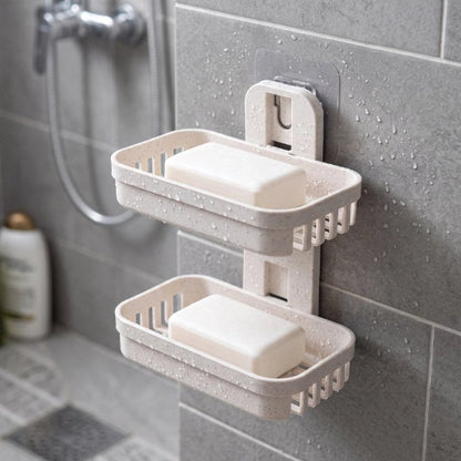 Porte-savon mural beige à deux paniers ajourés fixé au mur