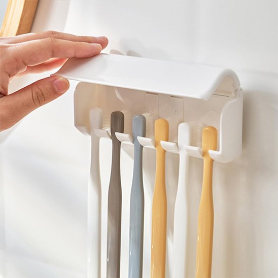 Support brosse à dents avec capot rabattable protégeant les brosses