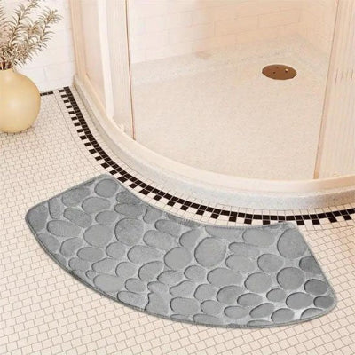 Tapis de douche gris en relief  motif de galets
